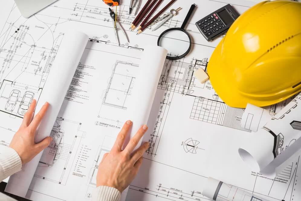 crop-architect-opening-blueprint-courtesy-freepik-com